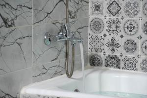 Salle de bains dans l'établissement Résidence America