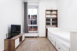 Televízia a/alebo spoločenská miestnosť v ubytovaní NovaNest Apartments - Kalwaryjska - by Upstairs