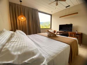 Cama ou camas em um quarto em Pousada Yamandu - Piscinas Aquecidas