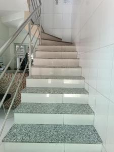 a set of stairs in a building with gravel at Hotel e Lanchonete Bom Gosto in Bom Jesus da Lapa
