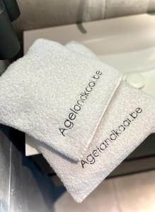 a white towel with the word accident registration on it at La bellétage by Agelandkaai be with Free Parking in Ghent