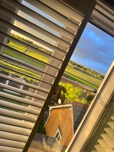 a view from the roof of a house with a window at Aintree Grand National Home in Aintree