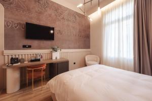 Ein Bett oder Betten in einem Zimmer der Unterkunft Zenith Premium Suites