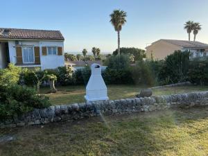 a stone retaining wall in front of a house at Casa vacanze Kastalia - Blu in Ragusa