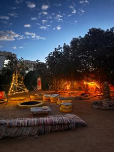 a park with a fire pit and a tent at Elrayga Camp Dahab in Dahab