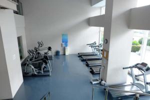 a gym with treadmills and elliptical machines at The Beacon Condo - Studio Tower 1 in Manila