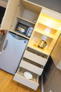 Η κουζίνα ή μικρή κουζίνα στο ALTEAN Apartments - Isabela Room +12 φωτογραφίες