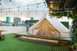 a tent on the roof of a building at Maria Deck Urban Glamping in Manila