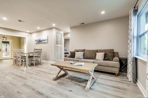 a living room with a couch and a table at Idyllic Oldsmar Vacation Rental 1 Mi to Beach! in Oldsmar
