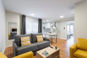 a living room with a couch and a table at InsideHome Palencia Catedral in Palencia