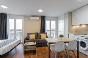 a living room with a couch and a table at InsideHome Palencia Catedral in Palencia