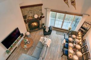 an overhead view of a living room with a fireplace at Huge condo in front of Tremblant ski resort in Mont-Tremblant