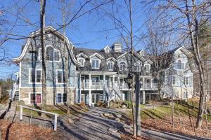 a large home with a large house at Huge condo in front of Tremblant ski resort in Mont-Tremblant