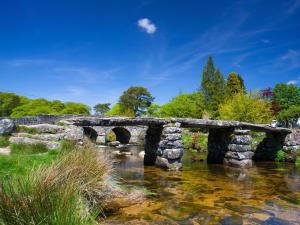 an old stone bridge over a stream at 1 Bed in Tavistock OTWIN in Lamerton