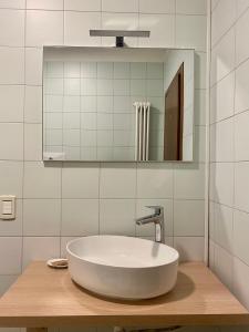 a bathroom with a white sink and a mirror at Angel's Suite in Vicenza +15 photos