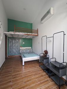a room with two bunk beds and a wooden floor at Mai Anh Garden in Soc Trang +62 photos