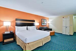 A bed or beds in a room at Holiday Inn Bismarck, an IHG Hotel