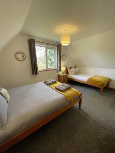 Krevet ili kreveti u jedinici u objektu Hideaway Lodge Hengar Manor 4 bed sleeps 8 to10