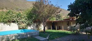a house with a swimming pool in the yard at Terrandino in San José de Maipo