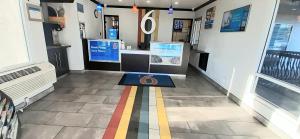 a store hallway with a colorful stripe on the floor at Motel 6 San Diego, CA Airport Harbor in San Diego