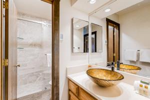 a bathroom with two sinks and a large mirror at Bridgepoint Condo on Trail Creek in Ketchum +57 photos