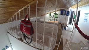 a room with a wall filled with cardboard and a room with a bed at Melgar-Tolima-Apartaestudio in Melgar +45 photos