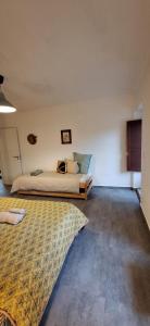 a bedroom with a bed and a rug on the floor at Casa Bonabal- 15 min from Ericeira 
