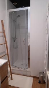 a shower with a glass door in a bathroom at LA CLOSERIE D'ISABAULT in Eu +13 photos