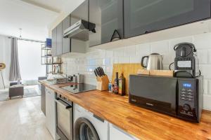 Kuchyňa alebo kuchynka v ubytovaní Appartement lumineux et spacieux - 8P + 16 fotografií