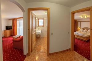 Łóżko lub łóżka w pokoju w obiekcie Hotel Rosslaufhof