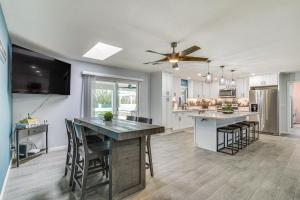 a kitchen with a table and chairs and a ceiling fan at Sunny Arizona Oasis with Views - 2 Mi to Lake Havasu in Lake Havasu City