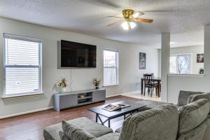 a living room with two couches and a tv at Indy Delight Charming House about 10 Mi to Downtown! in Indianapolis