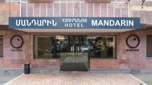 a building with a sign for a hotel at MANDARIN Hotel in Yerevan