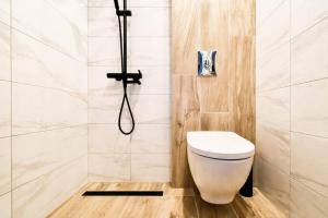 a bathroom with a toilet and a shower at Main Street Area Metro Washer&dryer View in Sofia +25 photos