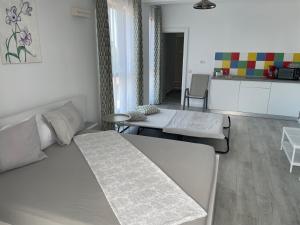 a living room with a couch and a table at MIKA Studios in Eforie Nord