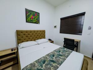 Postel nebo postele na pokoji v ubytování Hotel Central Plaza Medellin
