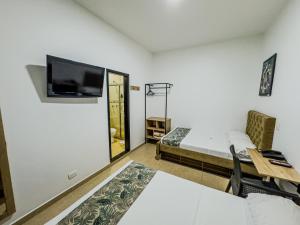TV a/nebo společenská místnost v ubytování Hotel Central Plaza Medellin
