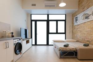 a living room with a washer and dryer at NEW BEACH flats VALENCIA in Valencia