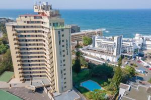 an aerial view of a building next to the ocean at Dolphin Coast Getaway in Ballito