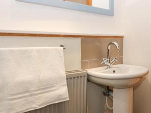 a bathroom with a sink and a towel at 16 Main Street in Ellon