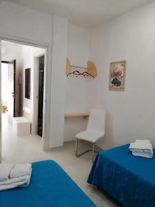Ένα ή περισσότερα κρεβάτια σε δωμάτιο στο Casa Cinzia diamond 104
