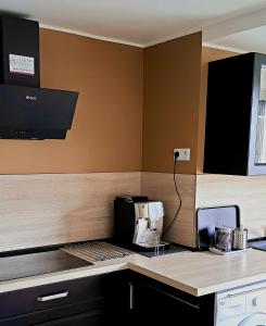 Kuchyňa alebo kuchynka v ubytovaní Appartement avec parking Cap d'Agde, La Falaise