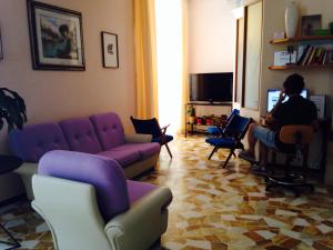 TV a/nebo společenská místnost v ubytování Hotel Lazzarini