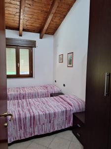 Ein Bett oder Betten in einem Zimmer der Unterkunft Casa Ponente e Casa Levante