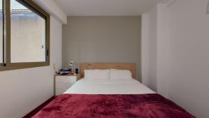 Posteľ alebo postele v izbe v ubytovaní Modern and bright three-bedroom in Eixample