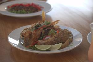 a plate of food with food on a table at Hotel Mar Azul 