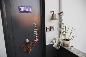 a door with a heart and a sign on it at Casa Vila Rosa in Peso da Régua