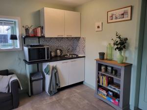 Kuchyň nebo kuchyňský kout v ubytování B & B De Tocht