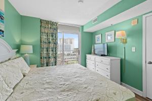 Ένα ή περισσότερα κρεβάτια σε δωμάτιο στο SeaWatch South 1002 Oceanview-Shore Drive Section +16 φωτογραφίες