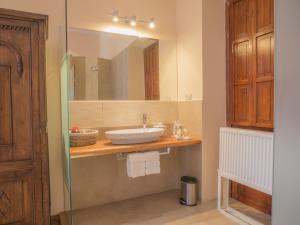 a bathroom with a sink and a mirror at Casa El Edén in Quito +27 photos